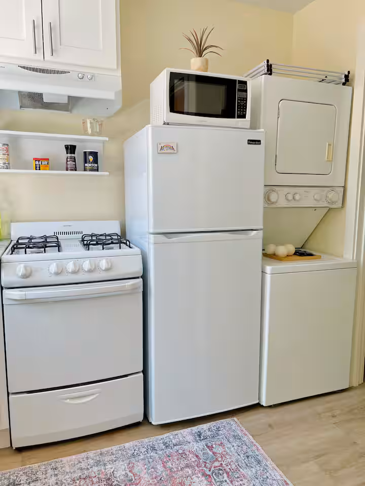 Full kitchen with gas stove and laundry