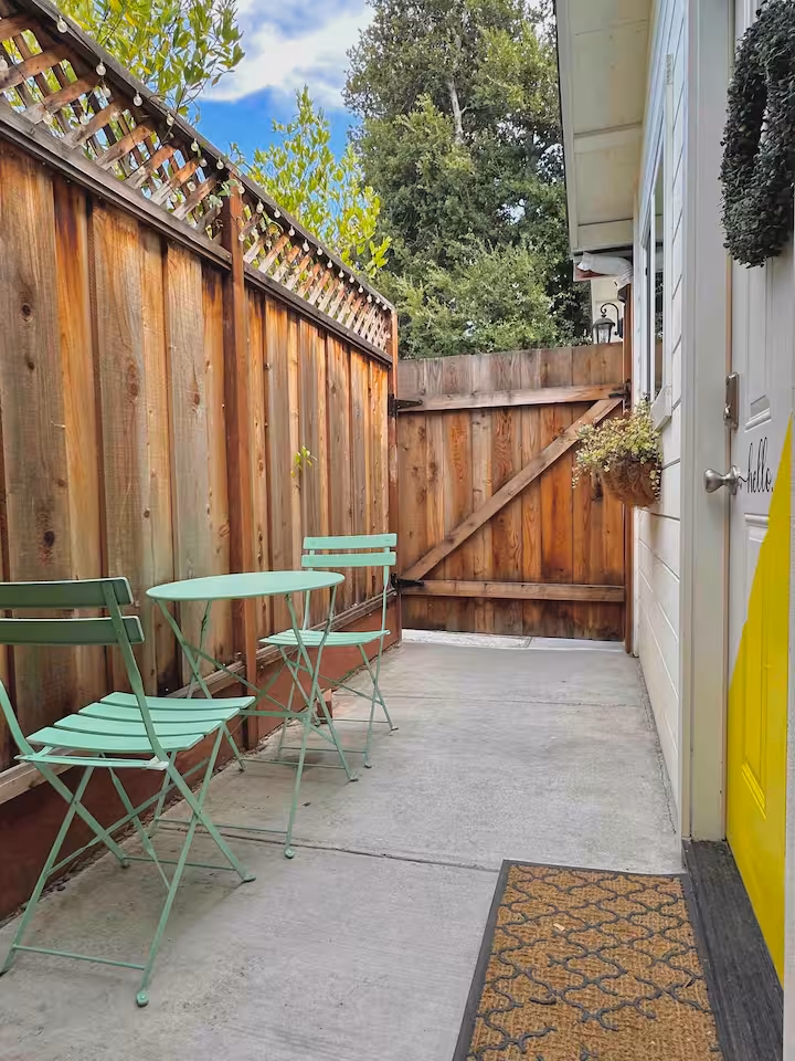 Private entrance with wreath and patio